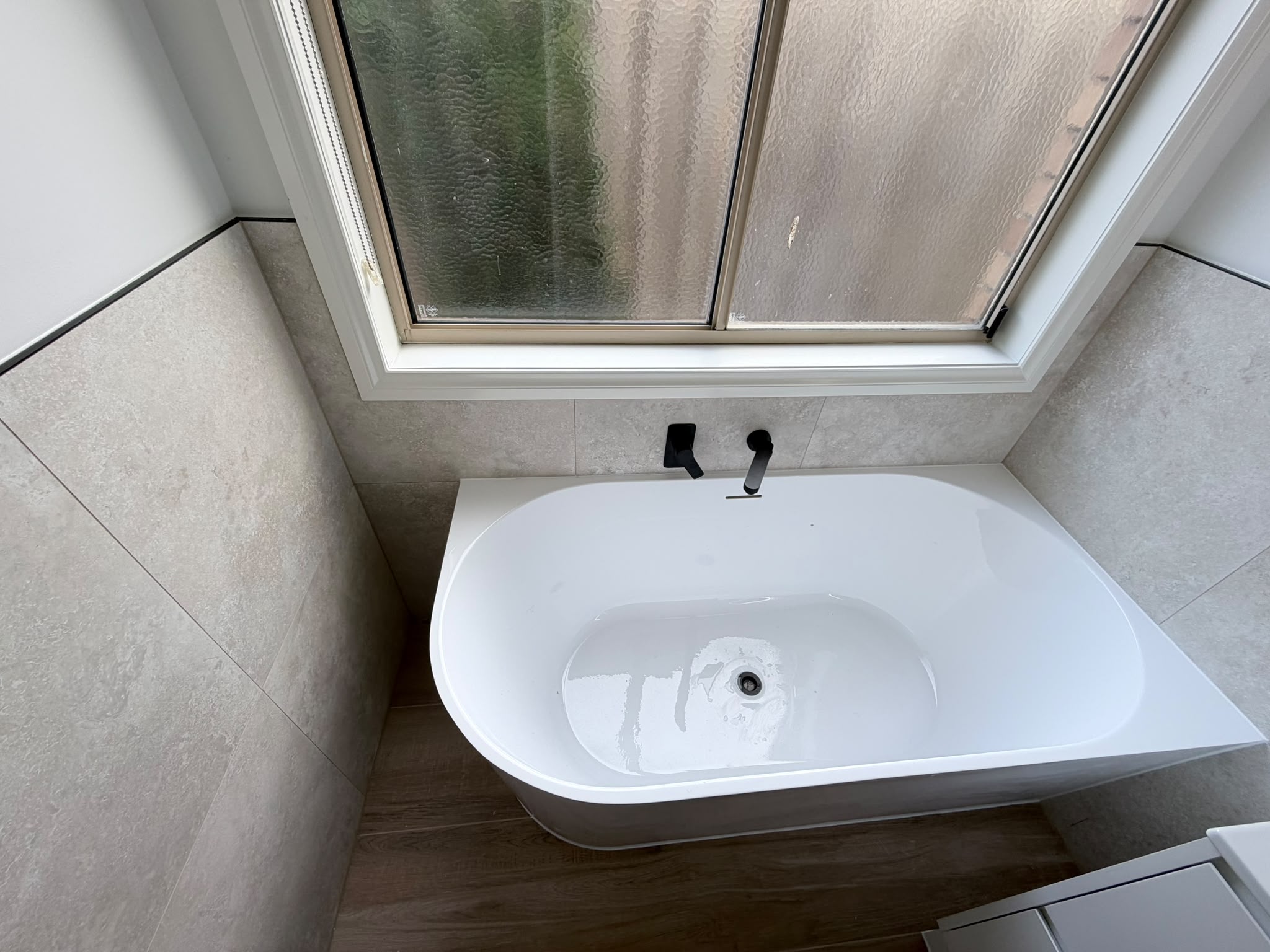 Freestanding Bath with Black Tapware